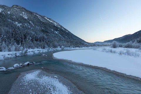 Isar valley in winter at temperatures of minus 18 degrees Celsius. Snow covered landscape with the