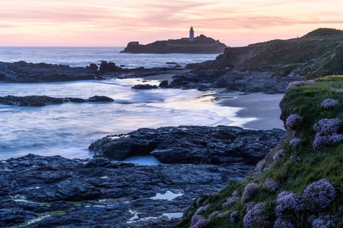 Godrevy Lighthouse, the lighthouse of Godrevy on Godrevy Island in the sea. In the evening at