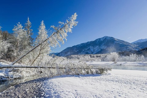 Isar valley in winter at temperatures of minus 18 degrees Celsius. Snow covered landscape with the