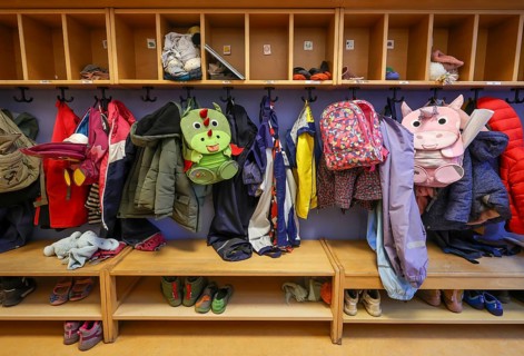 Germany - Symbolic image KITA. Children's coats, jackets and unicorn rucksacks hang on a coat rack