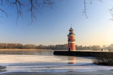 Pier with lighthouse on the large pond near the Fasanenschlößchen, Moritzburg, Saxony, Germany,