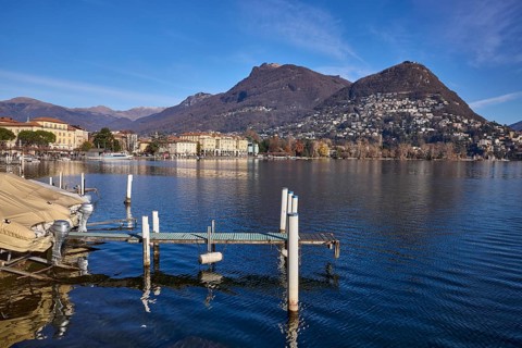 Jetty, motorboat, lake, hill, village, general development, shore, blue sky, cirrostratus clouds,