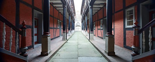 Inner courtyard with wooden portico in the Heiliggeistkloster monastery, Stralsund,