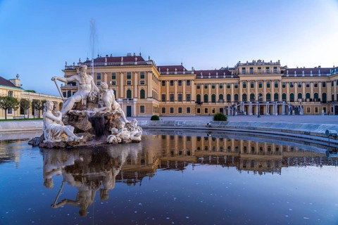Fountain in the courtyard of honour at Schönbrunn Palace at dusk, UNESCO World Heritage Site in