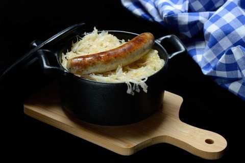 Nuremberg sausages with sauerkraut in a pot, Rostbratwürstchen, Germany, Europe