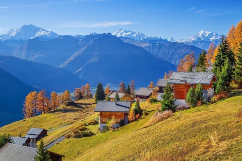 Autumn landscape with chalets above the Rhone valley and panorama of Fletschhorn 3985m, Dom 4545m,