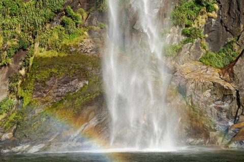 Rainbow over waterfall, Milford Sound, Fiordland National Park, South Island, Southland, New