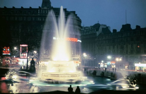 Illuminated fountain and neon lights in Trafalgar Square in the centre of London, England, United