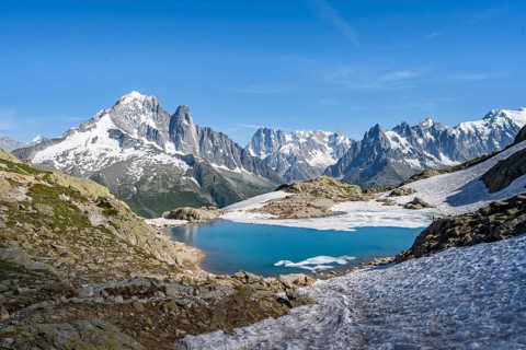 Mountain landscape with mountain lake Lac Blanc, mountain peaks, Aiguille Verte, Grandes Jorasses,
