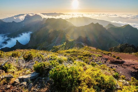 View of mountains over clouds from Pico Ruivo on sunset. Madeira island, Portugal, Europe