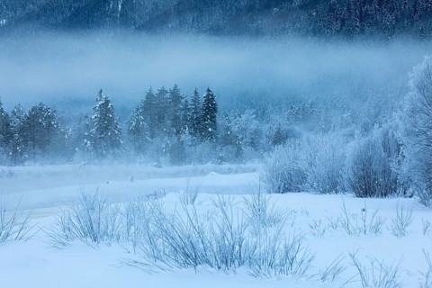 Isar valley in winter at temperatures of minus 18 degrees Celsius. Snow covered landscape with the