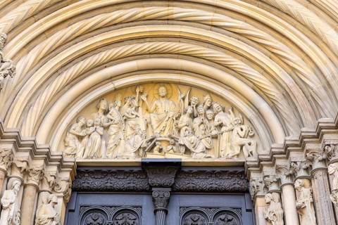 Group of Last Judgement figures with Christ as Judge of the World on the prince's portal at the