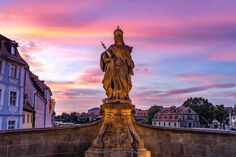 Statue of Empress Cunegonde on the Lower Bridge in Bamberg at sunset, Upper Franconia, Bavaria,