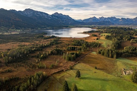 The Allgäu with Bannwaldsee and the Alps seen from the air, Schwangau, Allgäu, Bavaria, Germany,