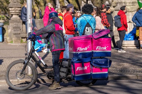 Bicycle courier of the Flink express delivery service, delivers groceries, currently in over 40