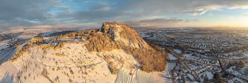 Aerial view, panorama of the snow-covered Hegau volcano Hohentwiel with Germany's largest castle
