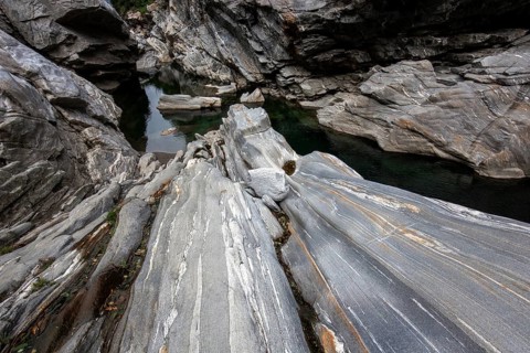 Rocks, granite rock formations in the Maggia River near Ponte Brolla, in the Maggia Valley, Valle