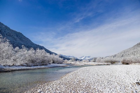 Isar valley in winter at temperatures of minus 18 degrees Celsius. Snow covered landscape with the