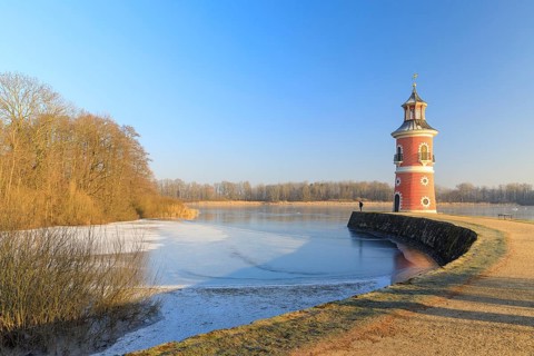Pier with lighthouse on the large pond near the Fasanenschlößchen, Moritzburg, Saxony, Germany,