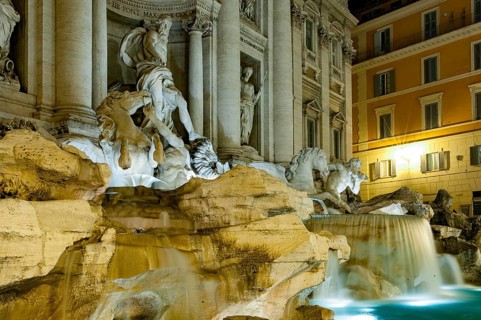 Night shot with long exposure photo side view of sculptures in Trevi Fountain Fontana di Trevi with