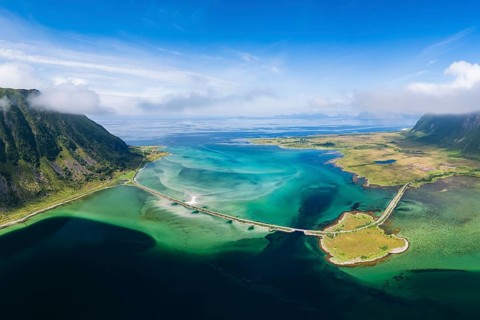 Fjord and mountains of the island Austvågøya, road on dam, Grunnførfjorden, Lofoten, Norway, Europe