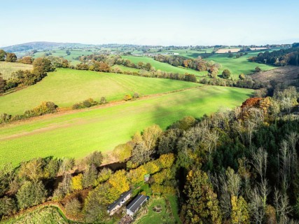 Fields and Farms over Skenfrith Castle from a drone, Monmouthshire, Wales, England, United Kingdom,