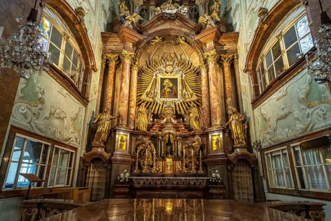 Altar of the baroque parish church Mariahilfer Kirche in Vienna, Austria, Europe