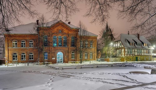 IGS and old Latin school illuminated by winter snow Stadthagen Germany