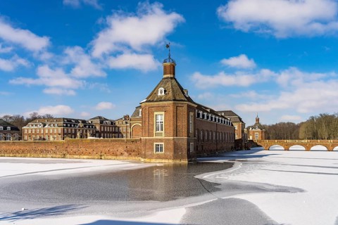 The snow-covered Nordkirchen Castle in winter, Nordkirchen, Münsterland, North Rhine-Westphalia,