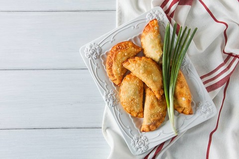 Fried chebureks, close-up, on a light background, no people