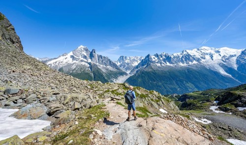 Mountaineers on a hiking trail in front of a mountain landscape, view of mountain peaks Aiguille