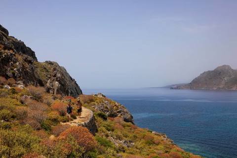 Hikers on the Sarella peninsula near Plakias, south coast, Crete, Greece, Europe