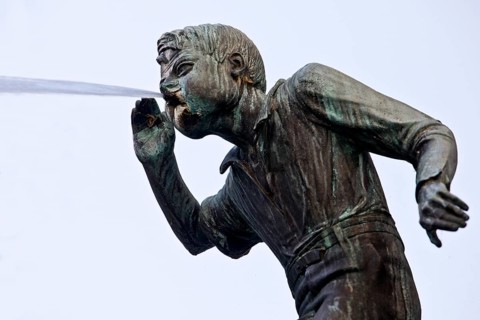 The spouting Schängel by Carl Burger on the Schängelbrunnen, landmark of the city of Koblenz,