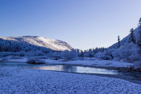 Isar valley in winter at temperatures of minus 18 degrees Celsius. Snow covered landscape with the