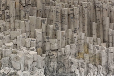 Reynisfjara Beach with Basalt rocks (Stuolabrrg) and the rock needles (Haidrangur), close to Vik i