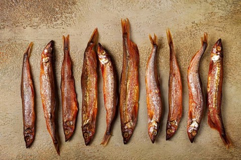 Cold smoked capelin, on the table, top view, no people