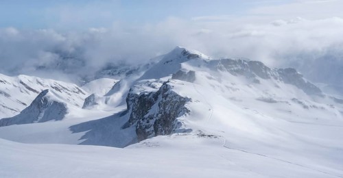 Snow-covered mountain landscape on the Wildhorn, cloudy mood, high tour, Bernese Alps, Bernese