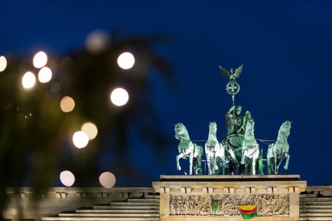 A banner For Democracy in Syria / Defend Rojava hangs at the Brandenburg Tor, Berlin, 16 December