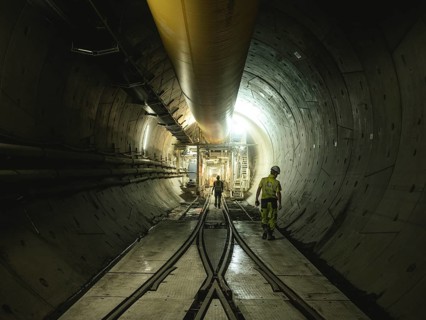 Workers in a tunnel section at the double-shield tunnel boring machine in section H53 of the