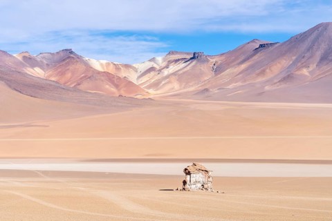 Rock formation in the Salvador Dalí Desert, Reserva Nacional de Fauna Andina Eduardo Abaroa, lagoon