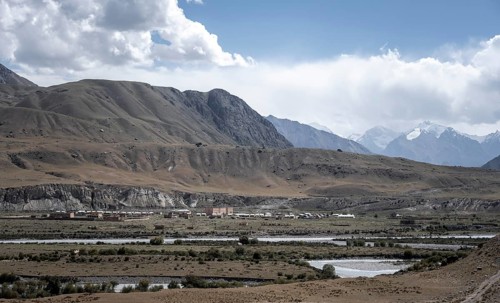 Town view, Engilchek river with village in mountain landscape, ghost town, Engilchek, Tian Shan,