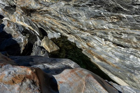 Rocks, granite rock formations in the Maggia River near Ponte Brolla, in the Maggia Valley, Valle