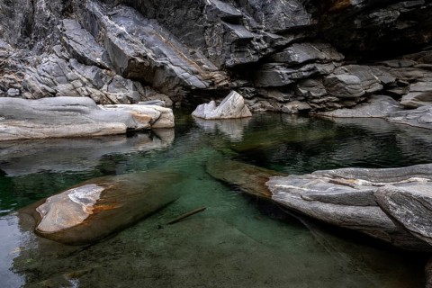 Rocks, granite rock formations in the Maggia River near Ponte Brolla, in the Maggia Valley, Valle