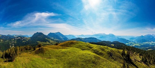 Drone shot, at the summit of the Taborberg with a view of the Osterhorn group and Dachstein massif,