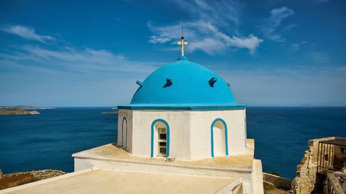 Blue church tower with sea view and clear sky, traditional Greek design, Church of Agios Georgios,