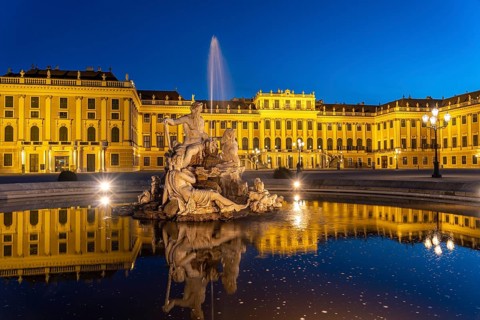 Fountain in the courtyard of honour at Schönbrunn Palace at dusk, UNESCO World Heritage Site in