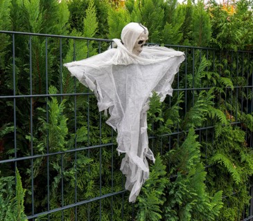 Ghost costume hanging on a fence, Berlin, Germany, Europe