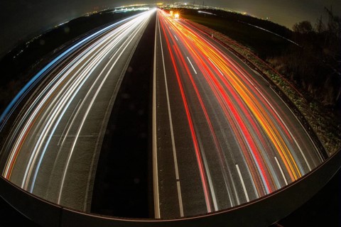 A7 Motorway, Autobahn, beside Kassel at night with light trails from the traffic headlights and