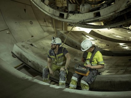 Workers in a tunnel section at the double-shield tunnel boring machine in section H53 of the
