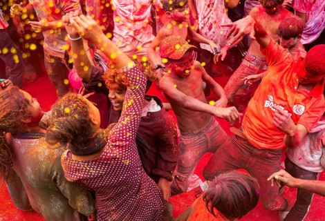 Revellers smear with Gulal or coloured powder and dance to play Holi, the Hindu spring festival of